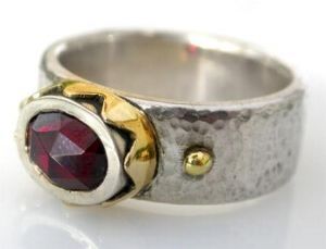 "Silver, 18ct crown ring with garnet"