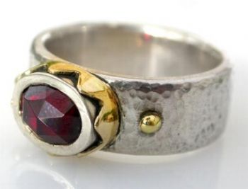 "Silver, 18ct crown ring with garnet"