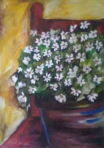 "daisies and a red chair"