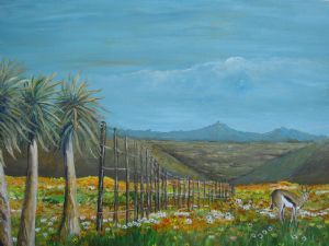 "A Buck Grazing Among the Flowers in the Field "